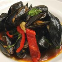 Spicy Mussels · Sauteed mussels with red peppers, basil, hot peppers and a spicy pepper corn sauce. Hot and ...