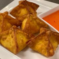Crab Rangoon · Deep-fried wonton wrappers filled with cream cheese, crab and seasonings, Served with apple ...