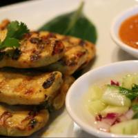 Satay Chicken · 5 skewers grilled sliced chicken, marinated in curry powder, mixed with coconut milk, and se...