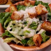 Caesar Salad · Crisp romaine lettuce, croutons and grated Romano cheese.