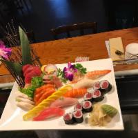 E9. Sushi and Sashimi Combo · 5 pieces sushi, 12 pieces sashimi with tuna roll.