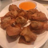 Szechwan Wontons · Steamed wontons filled with minced vegetables covered with a spicy chef soy sauce.