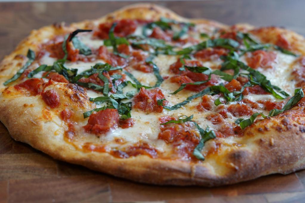 5-Cheese Margharita Pizza · Housemade marinara sauce, mozzarella, Asiago, Fontina, Parmesan, provolone, chopped tomato and fresh basil.