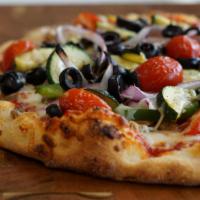 California Roasted Veggie Pizza · Housemade marinara sauce, mozzarella, cherry tomatoes, roasted red onion, fresh bell peppers...