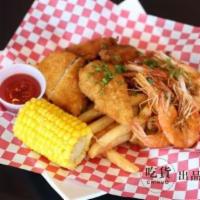 Fried Combo · Our Fried platter! Comes with Cajun wings, Cod fish, French Fries, Fried Shrimp, Corn. No su...