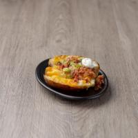 Fully Loaded Baked Potato · Loaded with butter, cheese, bacon, chives and sour cream.