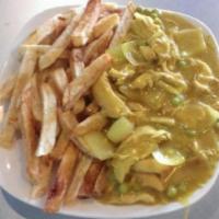Chicken Curry · Chicken cooked in a traditional curry sauce with peas and onion with a side of chips