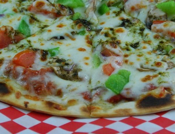 Fresh Veggie Pizza · Green pepper, mushroom, olives, tomato, onion and cheese.