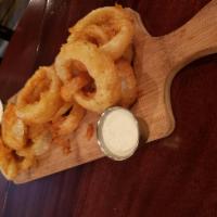 Onion Rings · Beer battered onion rings served with a chipotle ranch dressing.