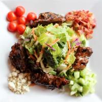 Steak Tip Salad · Mixed greens, blue cheese crumbles, tomato, applewood smoked bacon, cucumber and sliced red ...