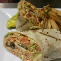 Buffalo Chicken Wrap · Crispy buffalo chicken, lettuce, tomatoes and blue cheese wrapped in a flour tortilla.
