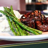 Steak Tips · Marinated in our own sweet chili sauce, served with mashed potatoes and vegetable of the day...