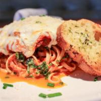 Chicken Parmigiana · Thin chicken breast, lightly fried, topped with marinara sauce and mozzarella cheese, served...