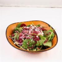 Beet Spinach Salad · Organic baby spinach, red onions, feta cheese, fresh mint and roasted almonds.