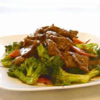 62. Beef with Broccoli · Served with rice.
