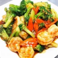 71. Shrimp with Broccoli · Served with rice.