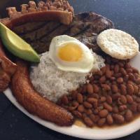 27. Bandeja Montanera · Country platter. Rice, beans, grilled steak, pork skin, fried egg, avocado, sweet plantain a...