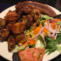 18. Costilas de Cerdo Fritas · Fried spare ribs. Rice, beans, salad and sweet plantain.