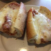 Chicken Cutlet Parmigiana Hero · A long sandwich on a roll. 