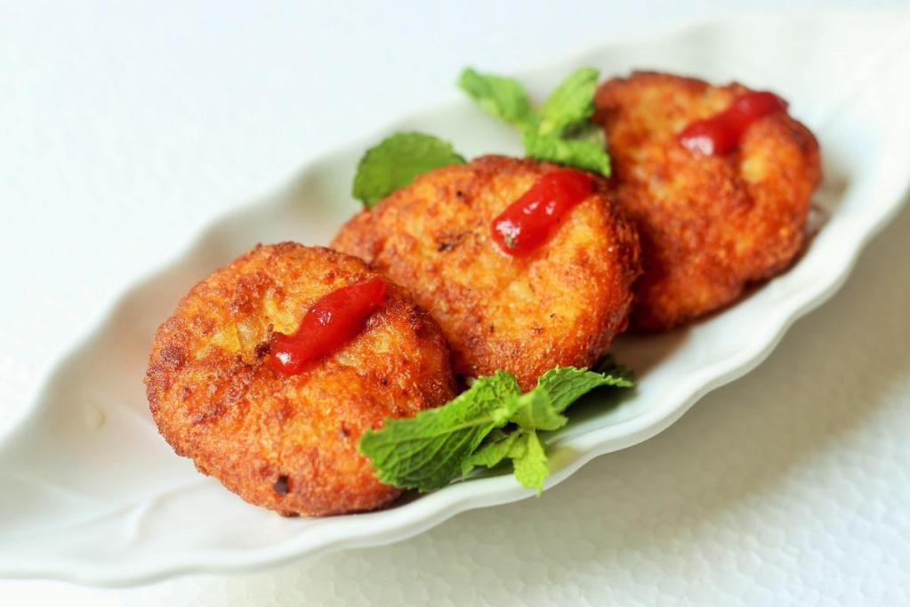 Aloo Tikki · Fried potato patties with chickpeas.