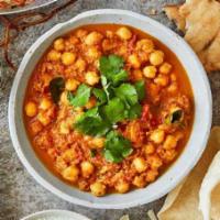 15. Punjabi Chole · Chickpeas cooked with onions, tomatoes, and fresh ground spices.