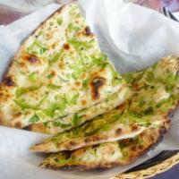 Bullet Nan · Flat bread stuffed with green chilies, garlic and chopped onions. Spicy.