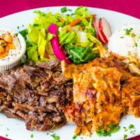 Combo Shawarma Plate · Slow roasted thinly sliced lamb and chicken. All plates served with rice, salad, hummus and ...