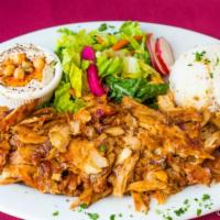 Chicken Shawarma Plate · Slow roasted thinly sliced chicken. All plates served with rice, salad, hummus and pita bread.