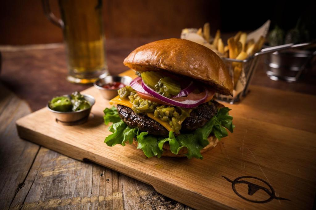 Hatch Chile Burger · 1/2 steakburger, green chile from Hatch NM, American cheese. Add bacon for an additional charge.