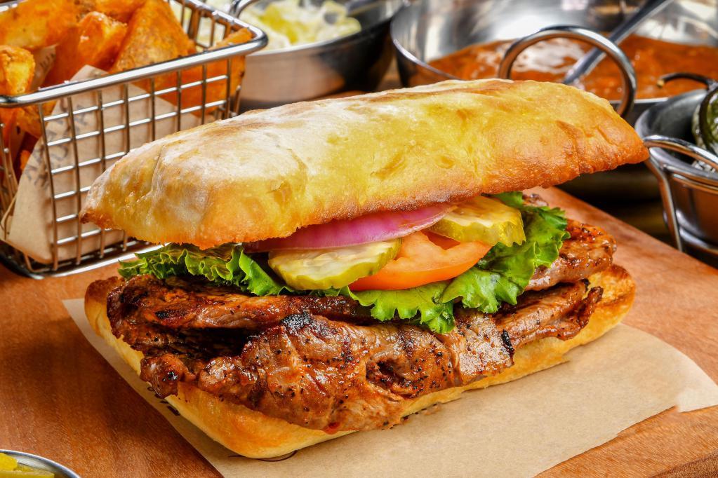 Rib Eye Sandwich · 1/2 lb. of sliced prime quality rib eye. Add Tampiquena topping for an additional charge (Green chile from hatch NM, grilled onions and jack cheese).