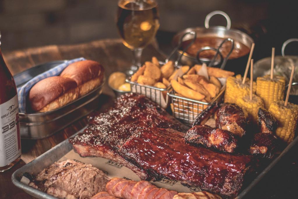 Personal BBQ Tray · Baby back ribs, pull pork, chicken breast, brisket, sausage, fries, corn on the cob and a dinner roll. Each entree includes complimentary pineapple coleslaw salad and beans.