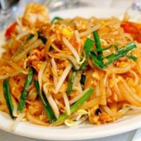 N10. Pad Thai Noodle · Thai glass noodle with chicken and shrimp, bean sprouts, white onion, green onion, egg and t...