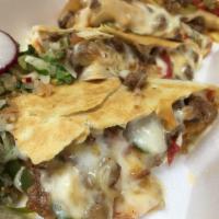 1. Steak Fajita Quesadilla · With onions, roasted red and green peppers. Served in a flour or whole wheat tortilla with m...