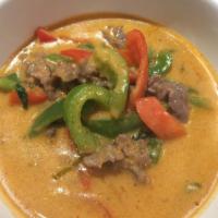 34. Panang Curry · Spicy panang curry in coconut milk with bell pepper and basil.
