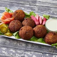 Falafel Plate · Vegan. 6 pieces. All vegetable patties made of fava beans, chickpeas, onions, parsley, cilan...
