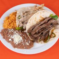 Taco Combo · Any 2 tacos with rice and beans.