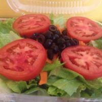 Green Salad · Romaine lettuce, tomatoes, carrots, cucumbers and black olives. 