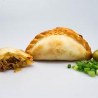 Beef Empanada · Premium ground beef, Spanish and green onions, green olives, hard boiled eggs and spices. 