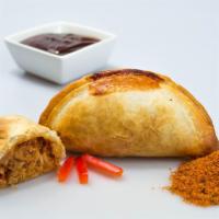 BBQ Pork Empanada · Pork loin, BBQ sauce, Spanish onions, red bell peppers and spices. 
