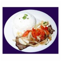 Bistec a la Chorrillana · Special seasoned steak topped with sauteed onions and tomatoes. 