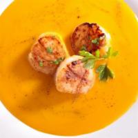 Saffron Scallops · Pan seared scallops in a creamy sauce with shallots, chives and saffron. Gluten free.
