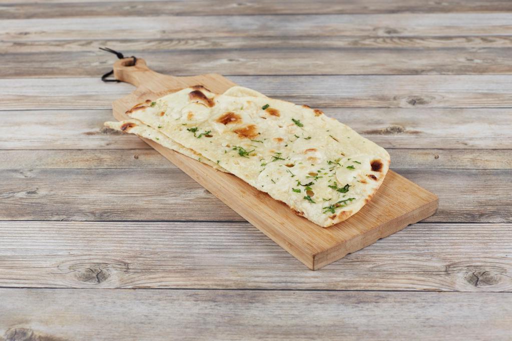 Garlic Naan · Traditional Indian Garlic Touched Bread Cooked in Tandoor Oven