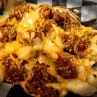 Chili Cheese Fries · Crinkle cut fries, beer cheese, chili and shredded cheddar cheese.