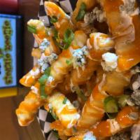 Buffalo Fries · Crinkle cut fries with tangy buffalo sauce, buttermilk ranch, bleu cheese crumbles and green...