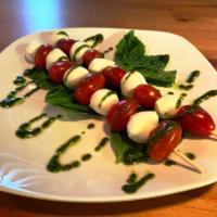 Caprese Salad · Tomato Cherry, Fresh Mozzarella, Pesto Sauce with Balsamic Reduction