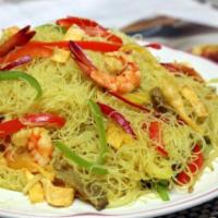 Singapore Rice Noodles · Roast pork and shrimp sauteed with ruby peppers, green peppers, onions and bean sprouts in a...