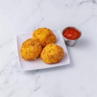 Rice Balls · 3 pieces. Breaded risotto mixed with ricotta, Parmesan and fresh mozzarella lightly fried wi...