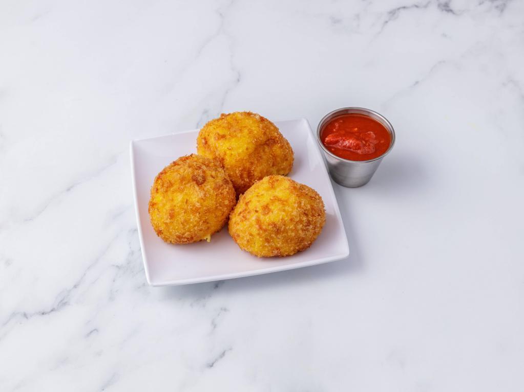 Rice Balls · 3 pieces. Breaded risotto mixed with ricotta, Parmesan and fresh mozzarella lightly fried with a choice of sauce.