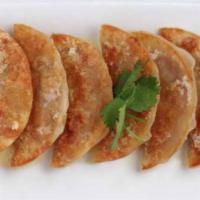 Chicken Potstickers · Savory filling wrapped in a thin dough wrapper into a dumpling and fried.