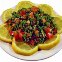 Tabouleh · Finely chopped parsley, cracked wheat, tomatoes, lemon juice and olive oil. Vegan fare.